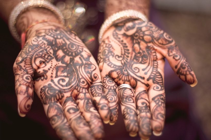 Hands decorated with mehndi