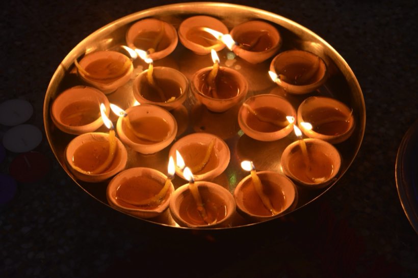 Platter of lit diyas